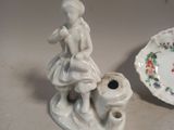 porcelain figurine of a girl with a dog and a plate