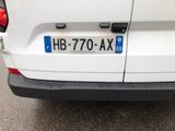 a white car with a blue license plate on it