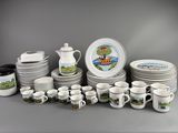 a lot of plates and cups that are sitting on a table