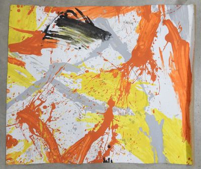 an orange and white painting on a piece of paper with paint splatters on it