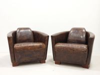 PAIRE DE FAUTEUILS club aviateur en cuir brun.