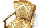 an image of a chair that has a gold and white pattern on it