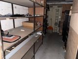 a room that has a bunch of shelves in it