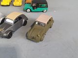 several toy cars are lined up in a row on a table