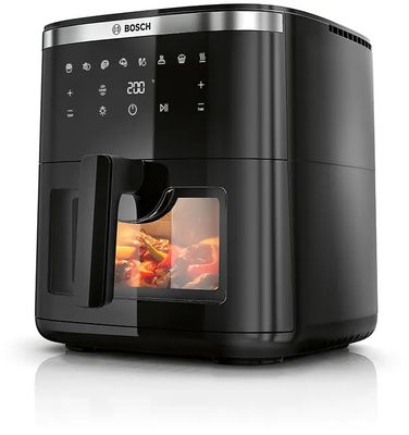 a close up of an air fryer with food inside of it