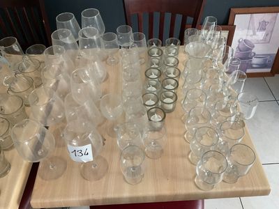 a lot of empty wine glasses sitting on a table