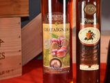three bottles of wine sitting on a table next to each other