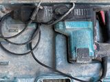 a drill that is sitting in a box on the floor