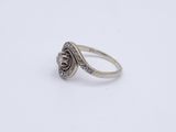 a close up of a ring on a white surface