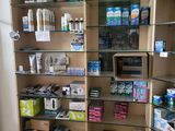 a shelf with many items in it in a room