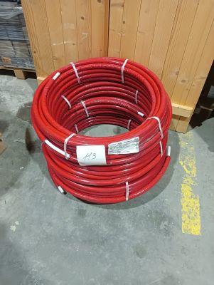 a stack of red hoses sitting on the floor