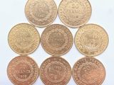 six types de pièces différents sont présentés sur une surface blanche