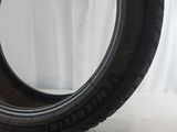 a close up of a tire on a white surface with a white background