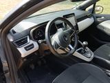the interior of a small car with a steering wheel and dashboard