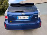 the back of a blue toyota rav parked in a parking lot