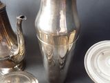 a lot of silver items that are on a table