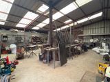 a room with a lot of chairs and tables inside of it