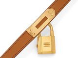 an image of a gold padlock and a brown leather belt