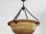 an antique hanging light fixture with a chain hanging from it ' s ceiling