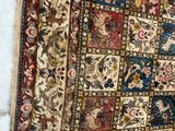 an image of a rug hanging on a wall in a room