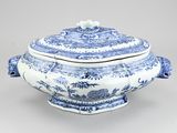 a blue and white tureeny dish with a lid