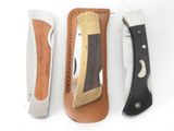 three different types of knives are lined up on a white surface