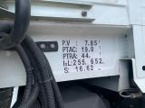 a close up of a truck ' s license plate with a hose attached to it