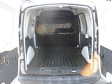 a white van with the door open and a dog in the back