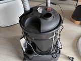 a vacuum that is sitting on the floor in the room
