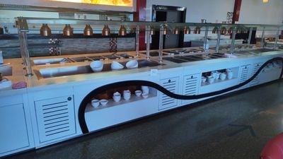 a long buffet with many different types of food on it