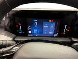 the steering wheel of a car with a digital display in the center