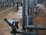 an image of a gym with equipment in the background