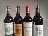 three bottles of red wine are lined up on a table