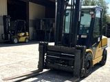 a forklift that is parked in front of a building