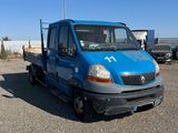 a blue truck that is parked in a parking lot
