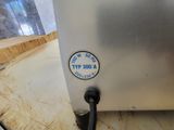 a close up of a toaster on a counter top