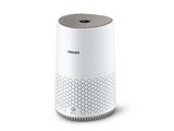 a white air purifier sitting on top of a white table