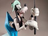 mickey mouse figurine holding a fishing pole and a fishing rod