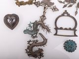 several pieces of jewelry are displayed on a white surface