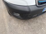 a close up of the front bumper of a white truck