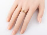 a close up of a person ' s hand with a ring on it