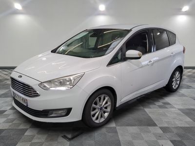 the white ford c - max is parked on a checkered floor