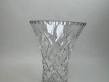 a glass vase that is sitting on a table