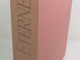 a pink book that is sitting on a table