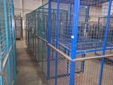 many cages that are in a building that is empty