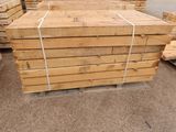 several stacks of wooden planks stacked on top of each other