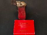 a lighter that is sitting on top of a red box