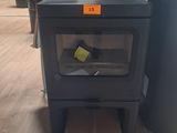 a stove with a box on the floor next to it