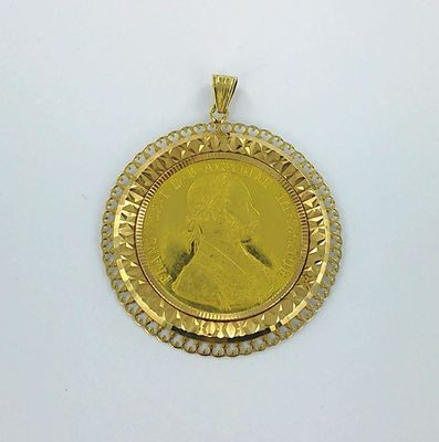 l'image d'une pièce d'or sur laquelle figure le visage d'une femme