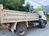 a dump truck that is parked on the side of the road